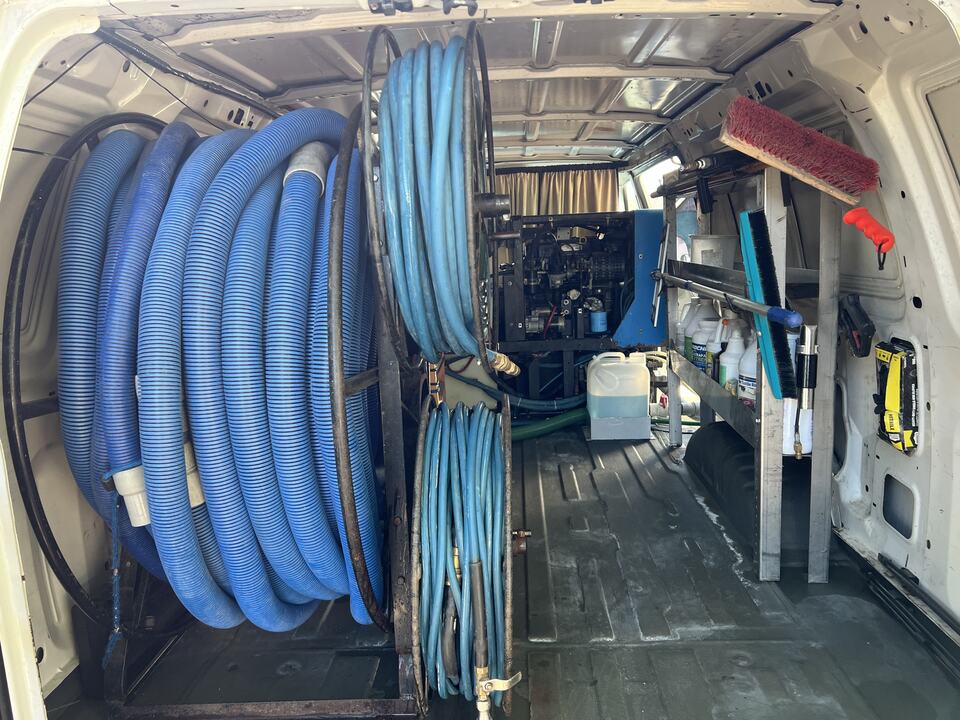 Hose reels and truck-mounted equipment inside the service van