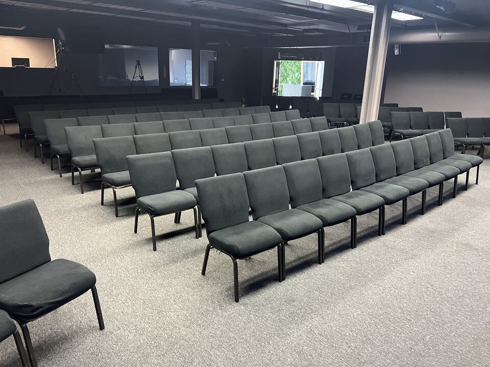Rows of chairs over a carpeted gathering space